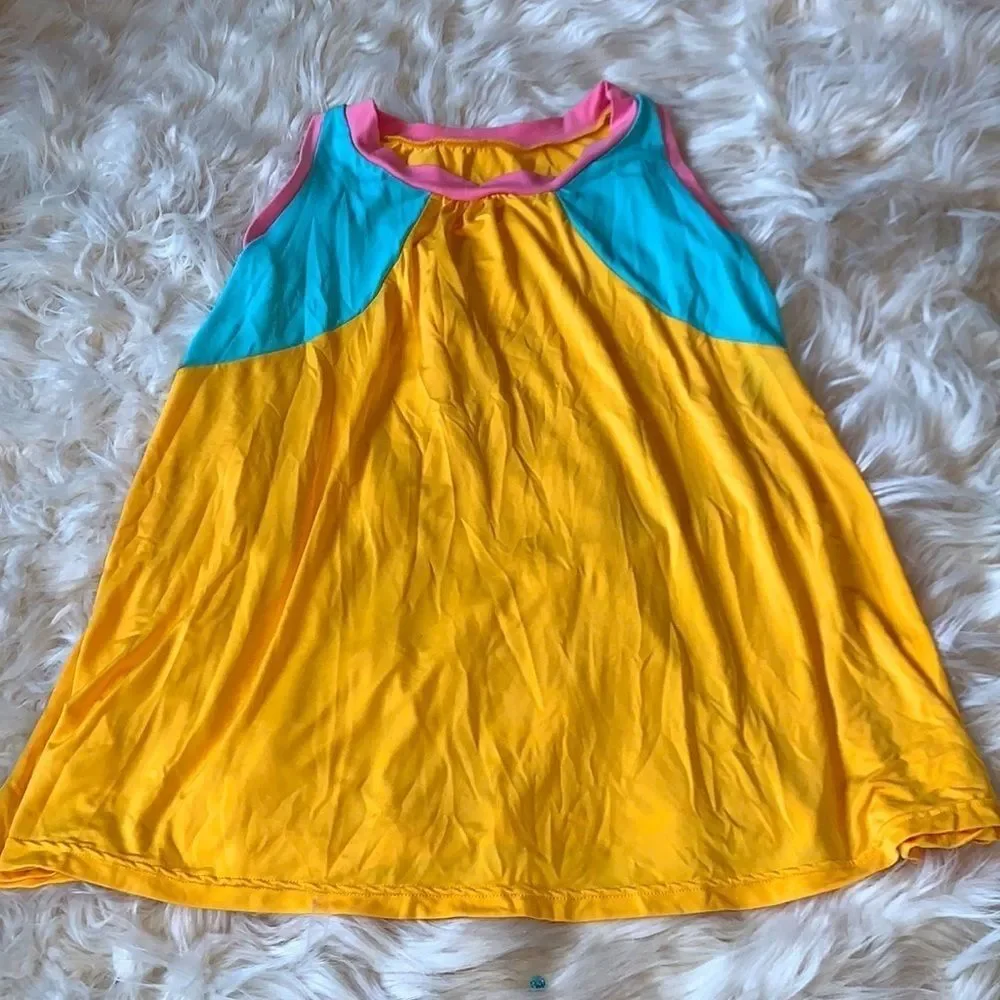 Loose dance a-line dress in yellow, turquoise and pink.